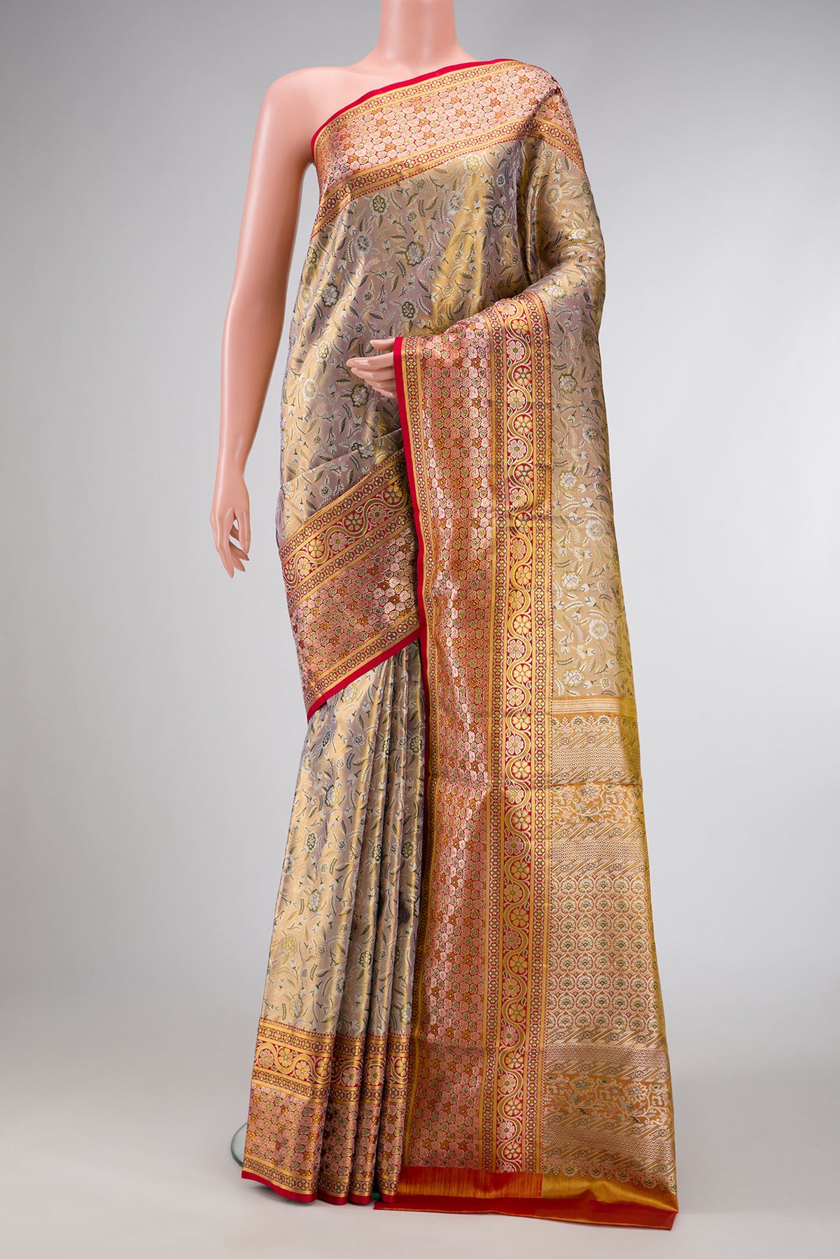 Gold Dual Tone Kanchipuram Tissue Silk Saree with Zari Brocade on the body and Fancy Border.  displayed on a mannequin