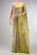 Pista Green Dual Tone Kanchipuram Tissue Silk Saree with Zari Brocade on the body and Fancy Border.  displayed on a mannequin