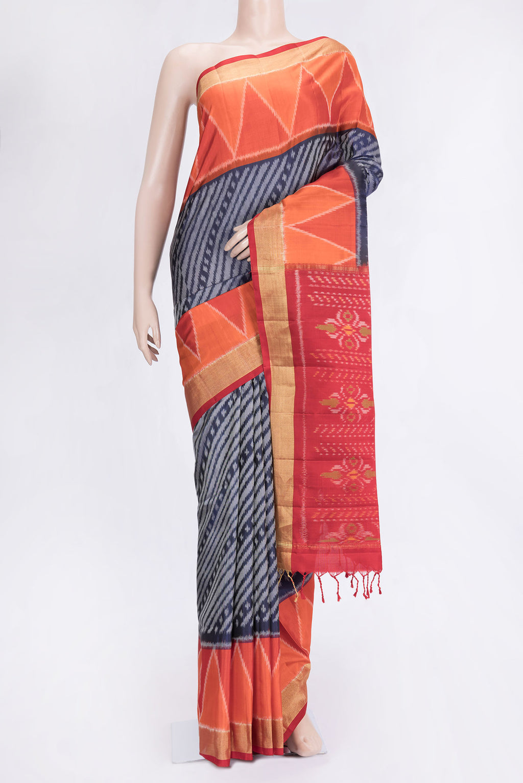 Navy Blue Dual Tone Soft Silk Saree with Ikat Print on the body and Ikat Border.  displayed on a mannequin