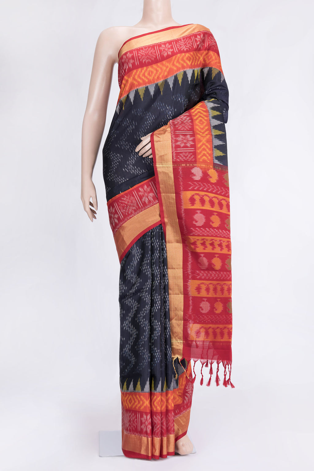 Navy Blue Dual Tone Soft Silk Saree with Ikat Print on the body and Ikat Border.  displayed on a mannequin
