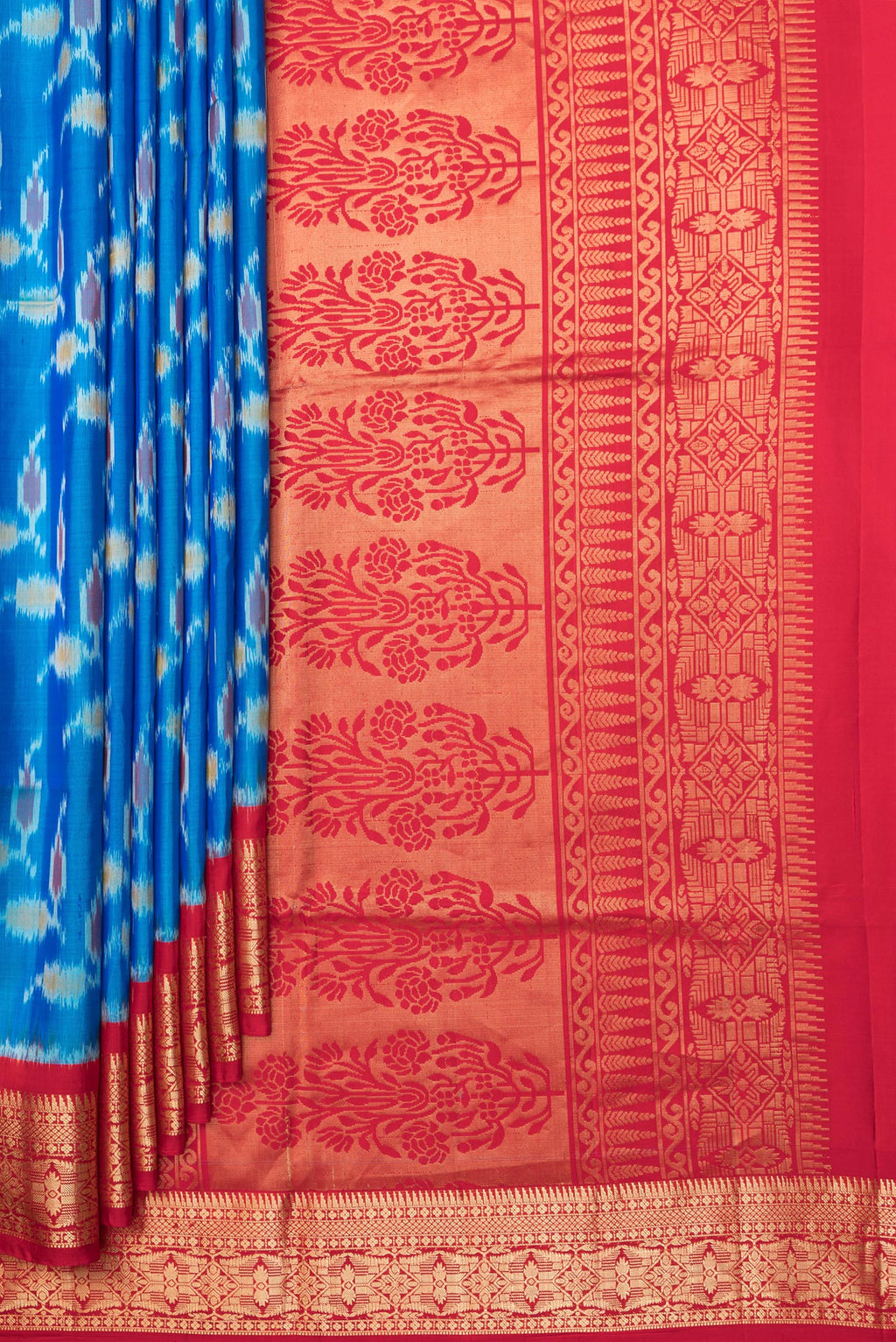 Pleats and pallu of Pure Silk Peacock Blue Dual Tone Soft Saree with Ikat Print on the body and Zari Border. 