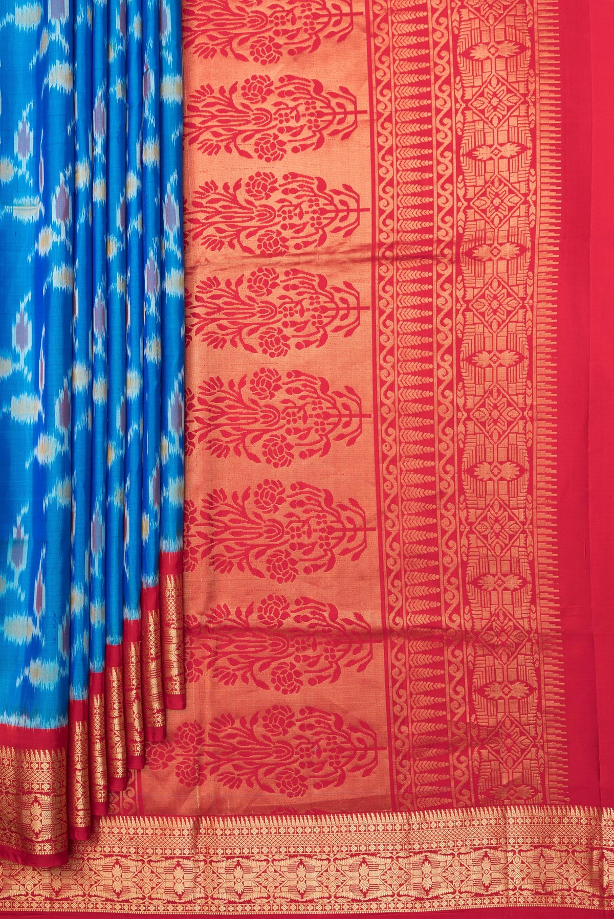 Pleats and pallu of Pure Silk Peacock Blue Dual Tone Soft Saree with Ikat Print on the body and Zari Border. 