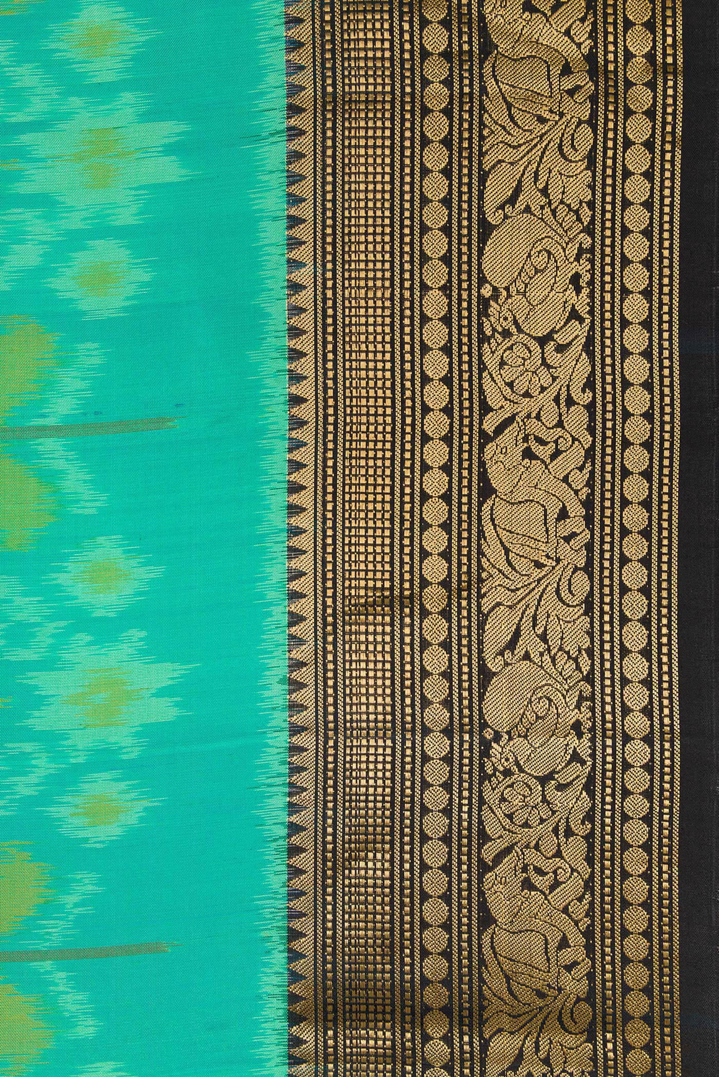 Border image of Sea Green Dual Tone Soft Silk Saree with Ikat Print on the body and Zari Border. 