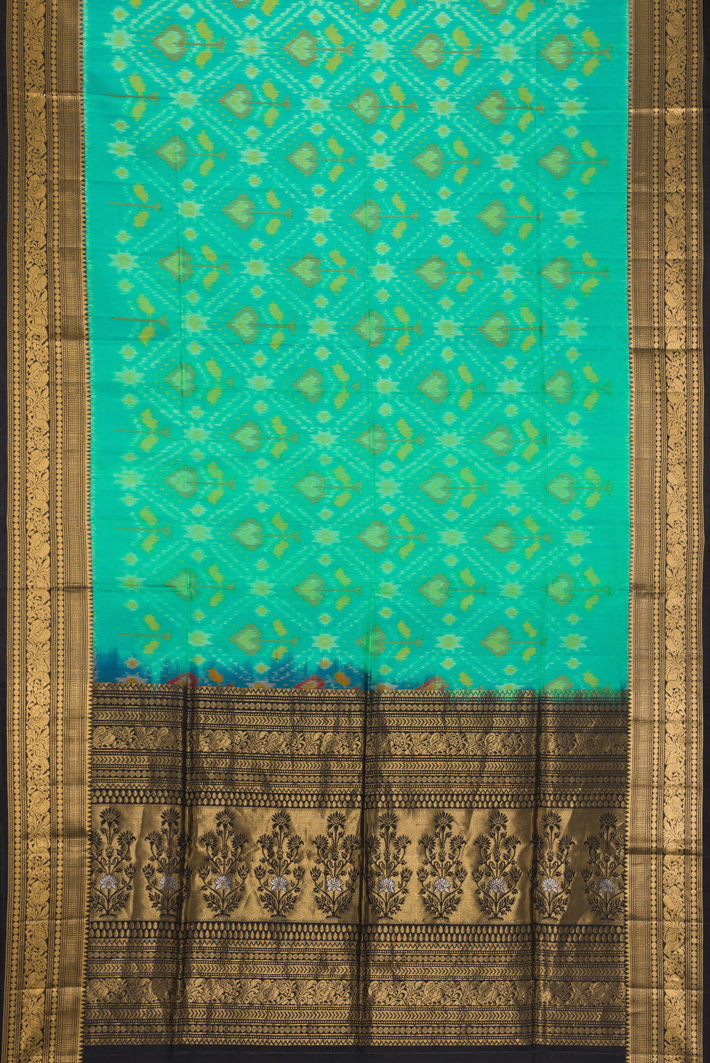 Flat view of Sea Green Dual Tone Soft Silk Saree with Ikat Print on the body and Zari Border. 