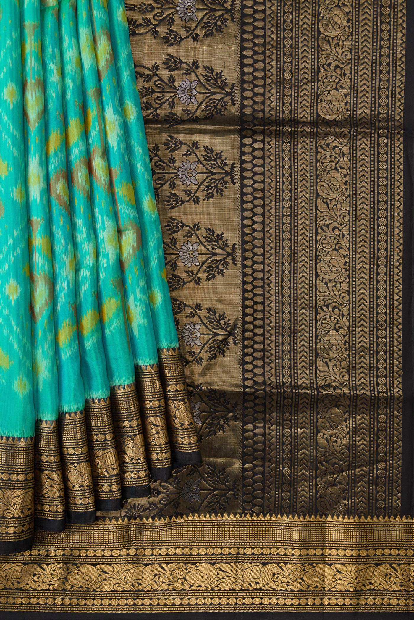 Pleats and pallu of Sea Green Dual Tone Soft Silk Saree with Ikat Print on the body and Zari Border. 