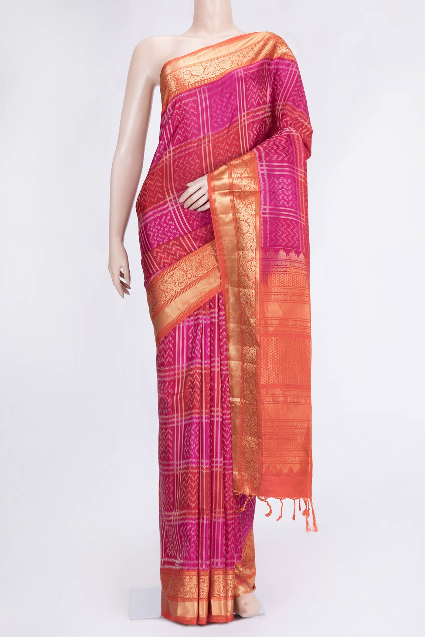 Pink Dual Tone Soft Silk Saree with Ikat Print on the body and Zari Border.  displayed on a mannequin