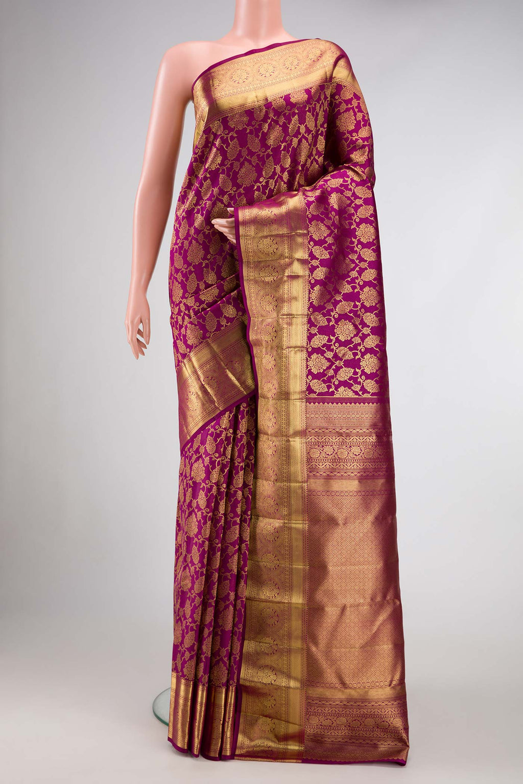 Magenta Dual Tone Kanchipuram Silk Saree with Zari Brocade on the body and Zari Border.  displayed on a mannequin
