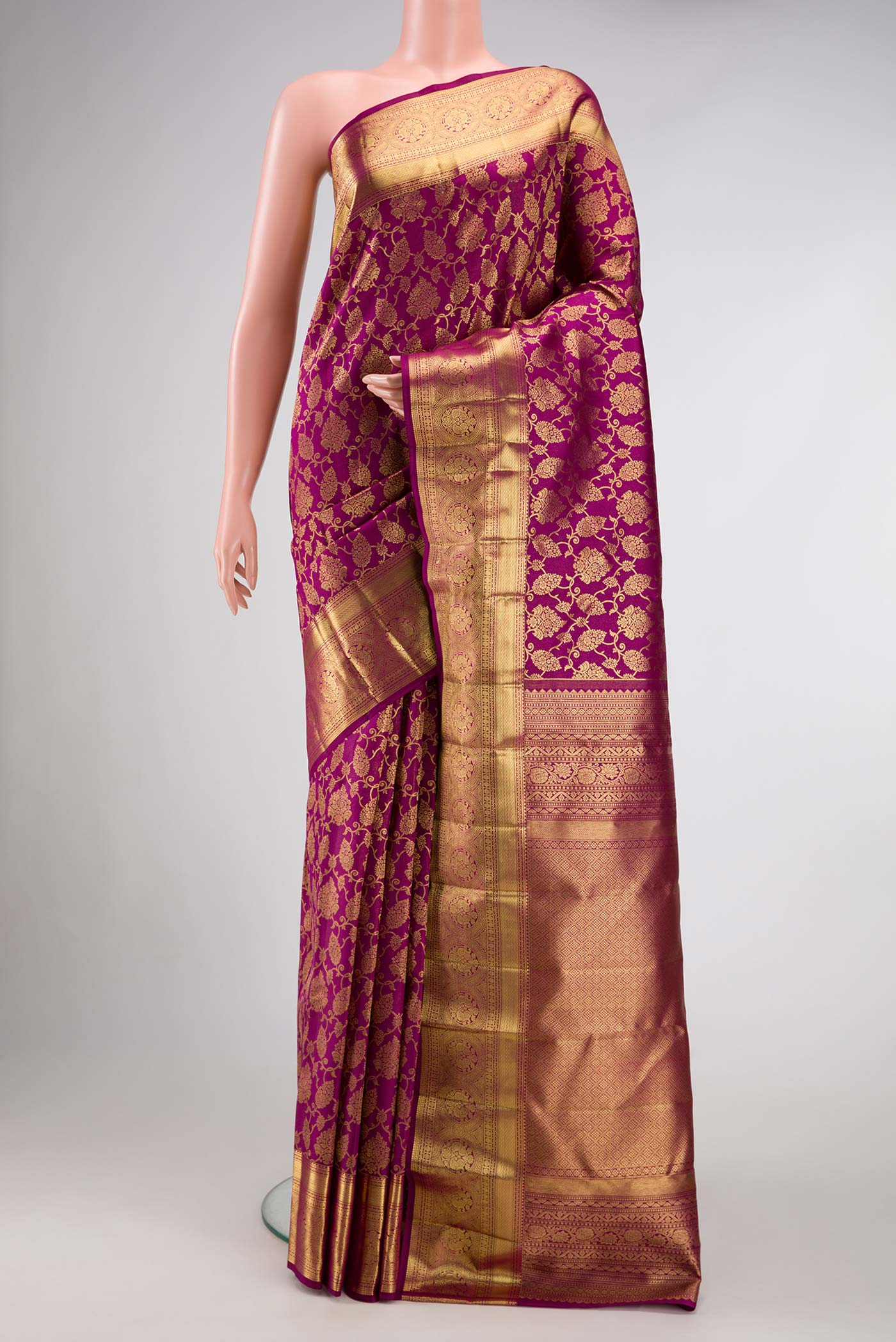 Magenta Dual Tone Kanchipuram Silk Saree with Zari Brocade on the body and Zari Border.  displayed on a mannequin