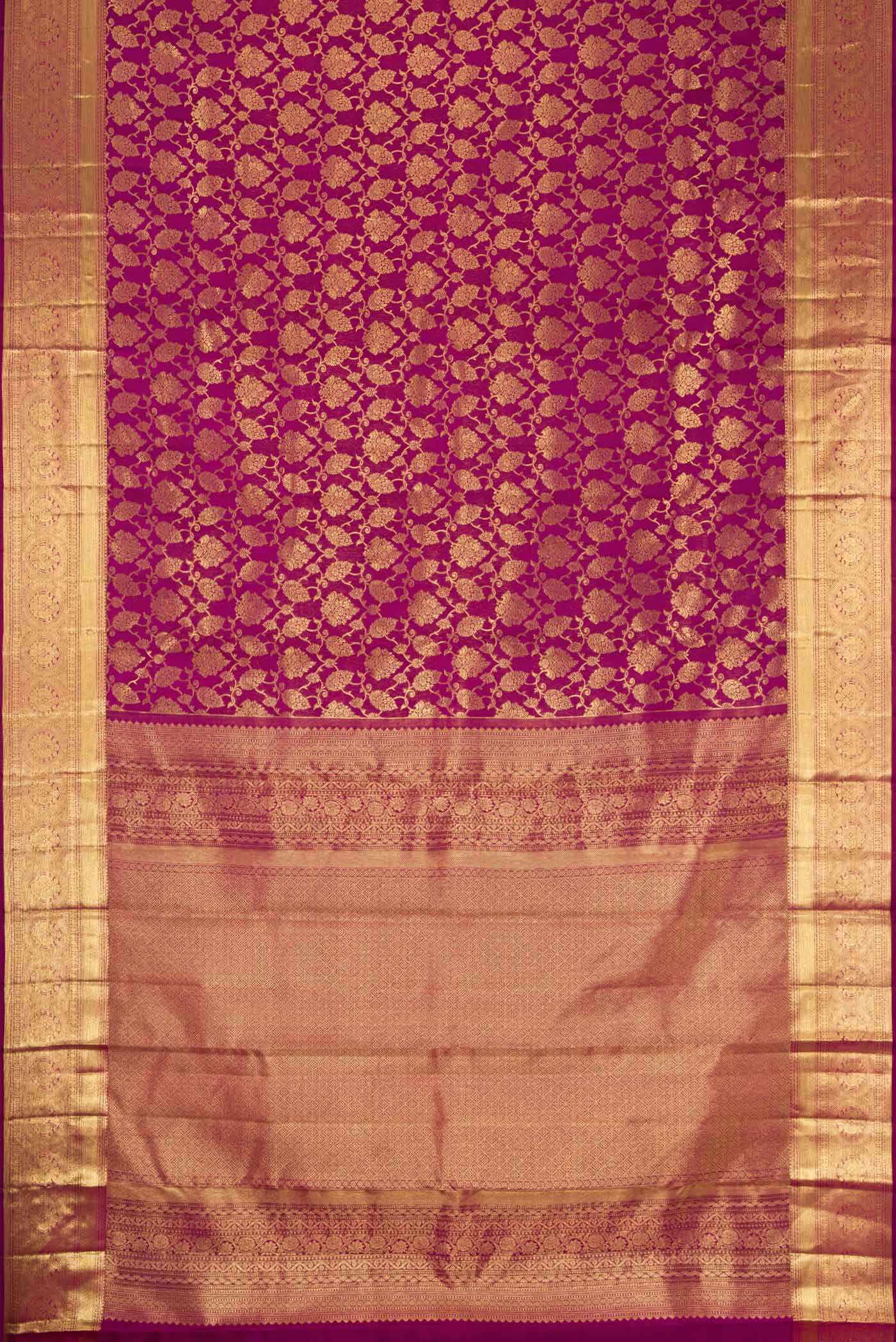 Flat view of Magenta Dual Tone Kanchipuram Silk Saree with Zari Brocade on the body and Zari Border. 