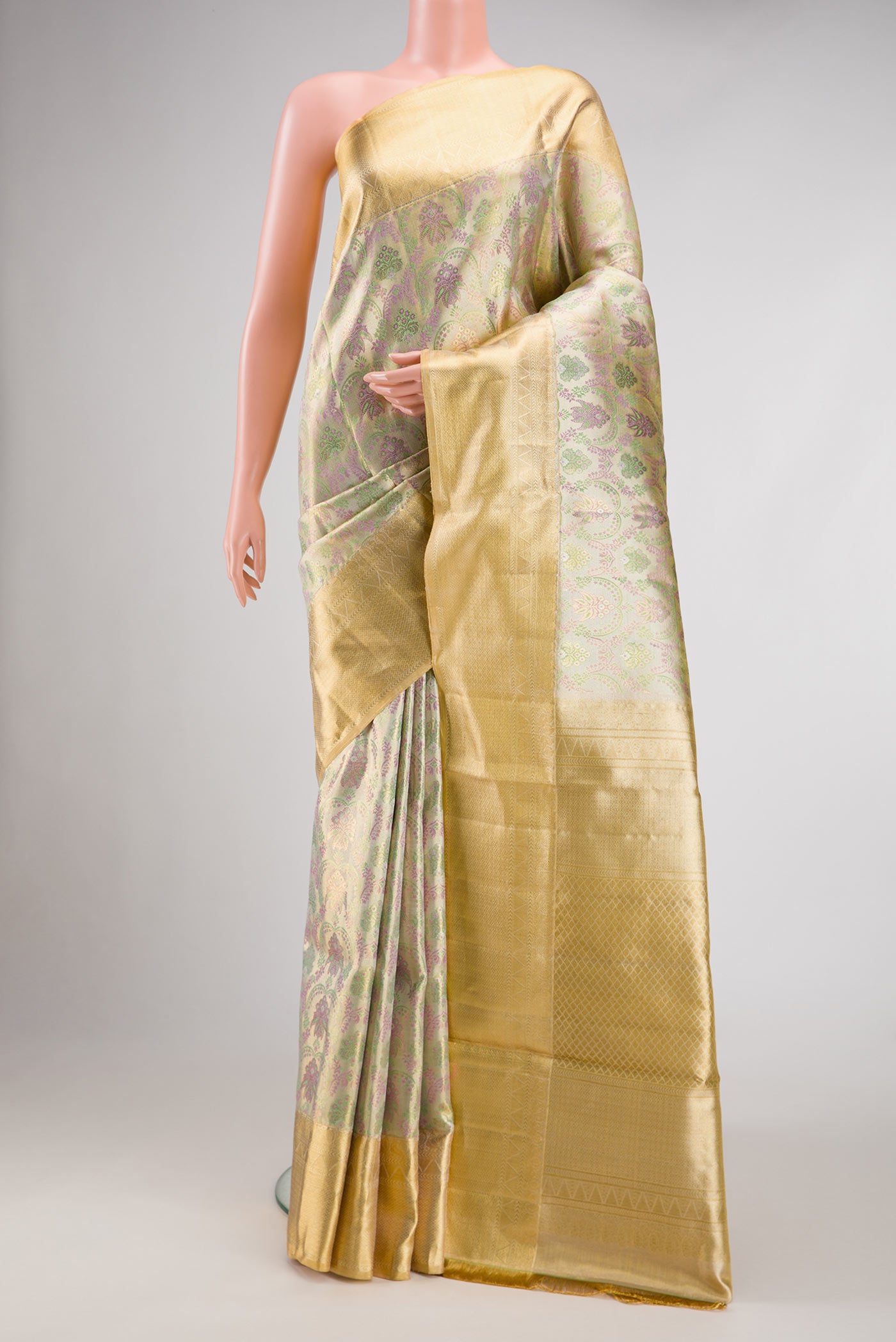 Silver Dual Tone Kanjivaram Tissue Silk Saree with Zari Brocade on the body and Zari Border.  displayed on a mannequin