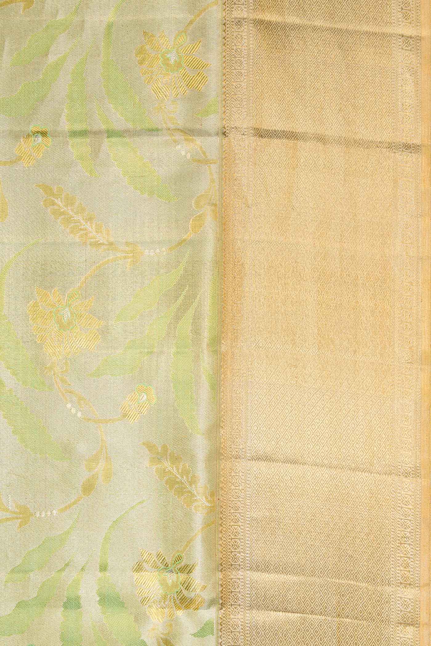 Border image of Pista Green Dual Tone Kanjivaram Tissue Silk Saree with Zari Brocade on the body and Zari Border. 