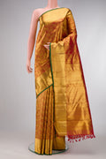 Maroon Dual Tone Kanjivaram Tissue Silk Saree with Zari Brocade on the body and Zari Border.  displayed on a mannequin