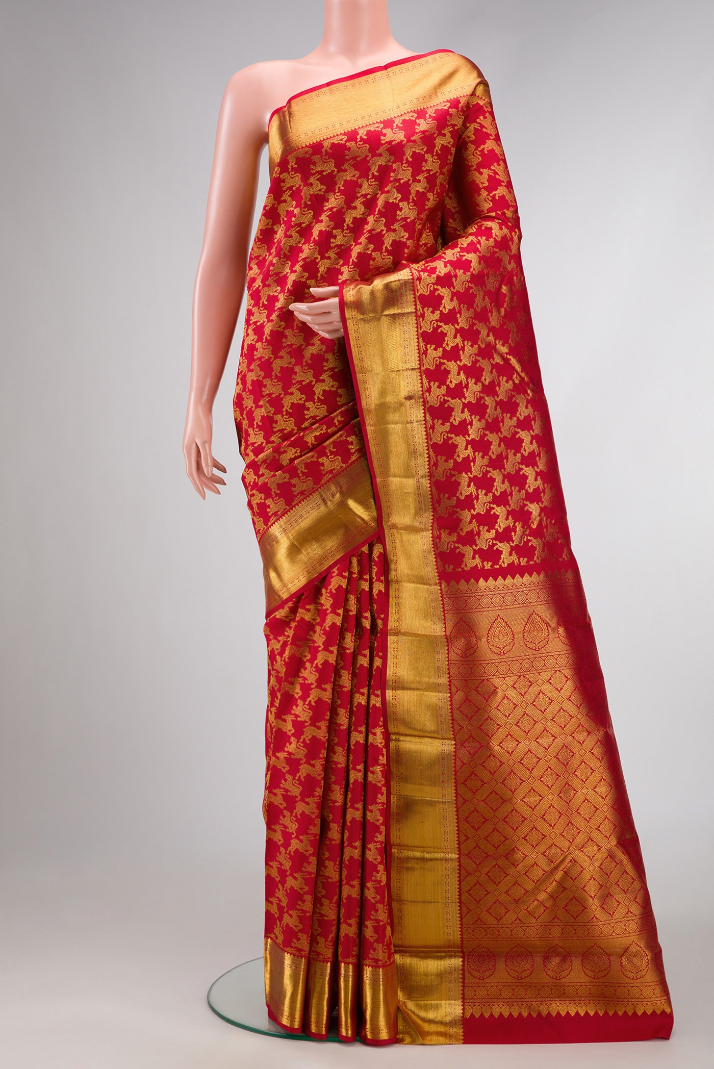 Red Dual Tone Kanchipuram Silk Saree with Zari Brocade on the body and Zari Border.  displayed on a mannequin