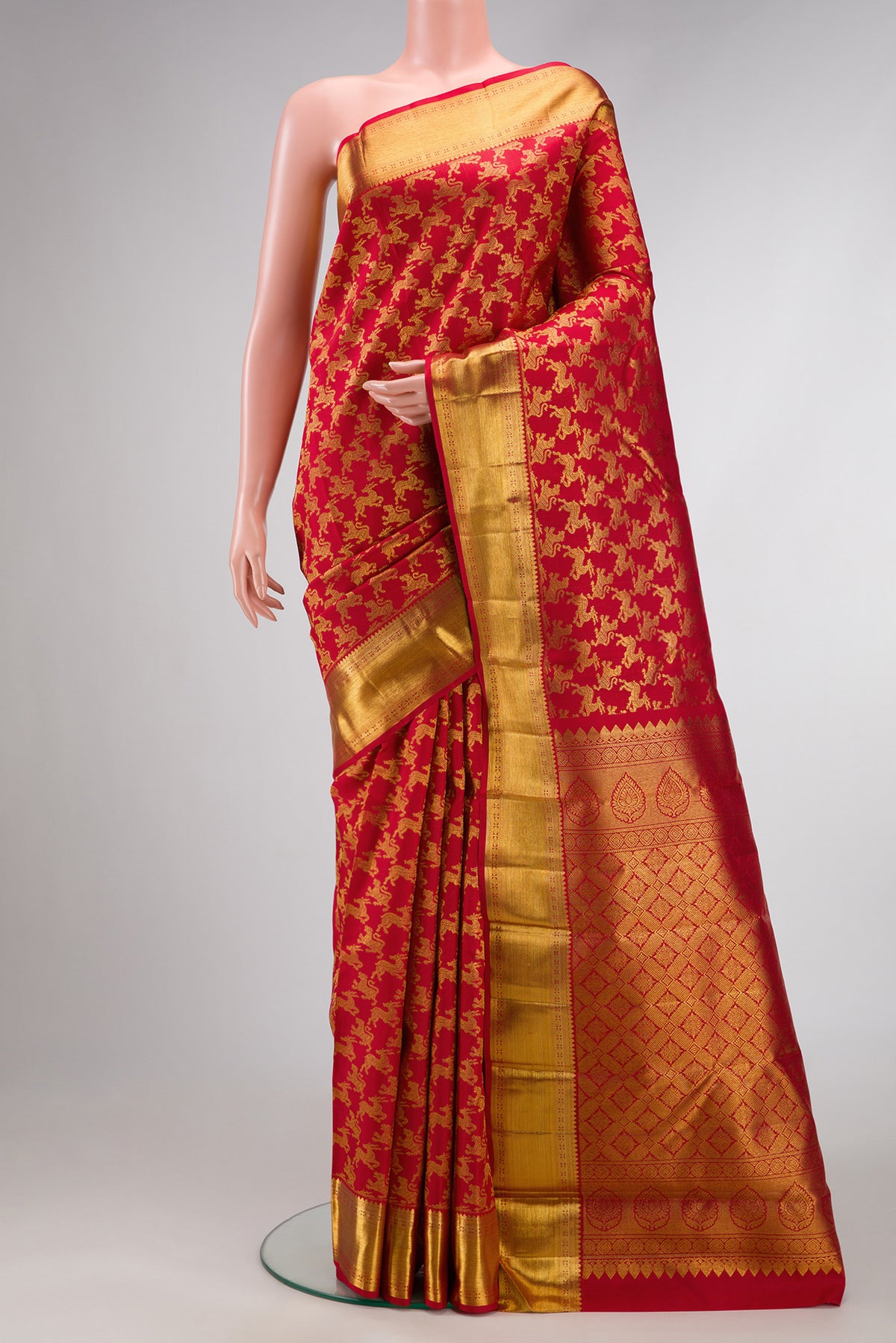 Red Dual Tone Kanchipuram Silk Saree with Zari Brocade on the body and Zari Border.  displayed on a mannequin