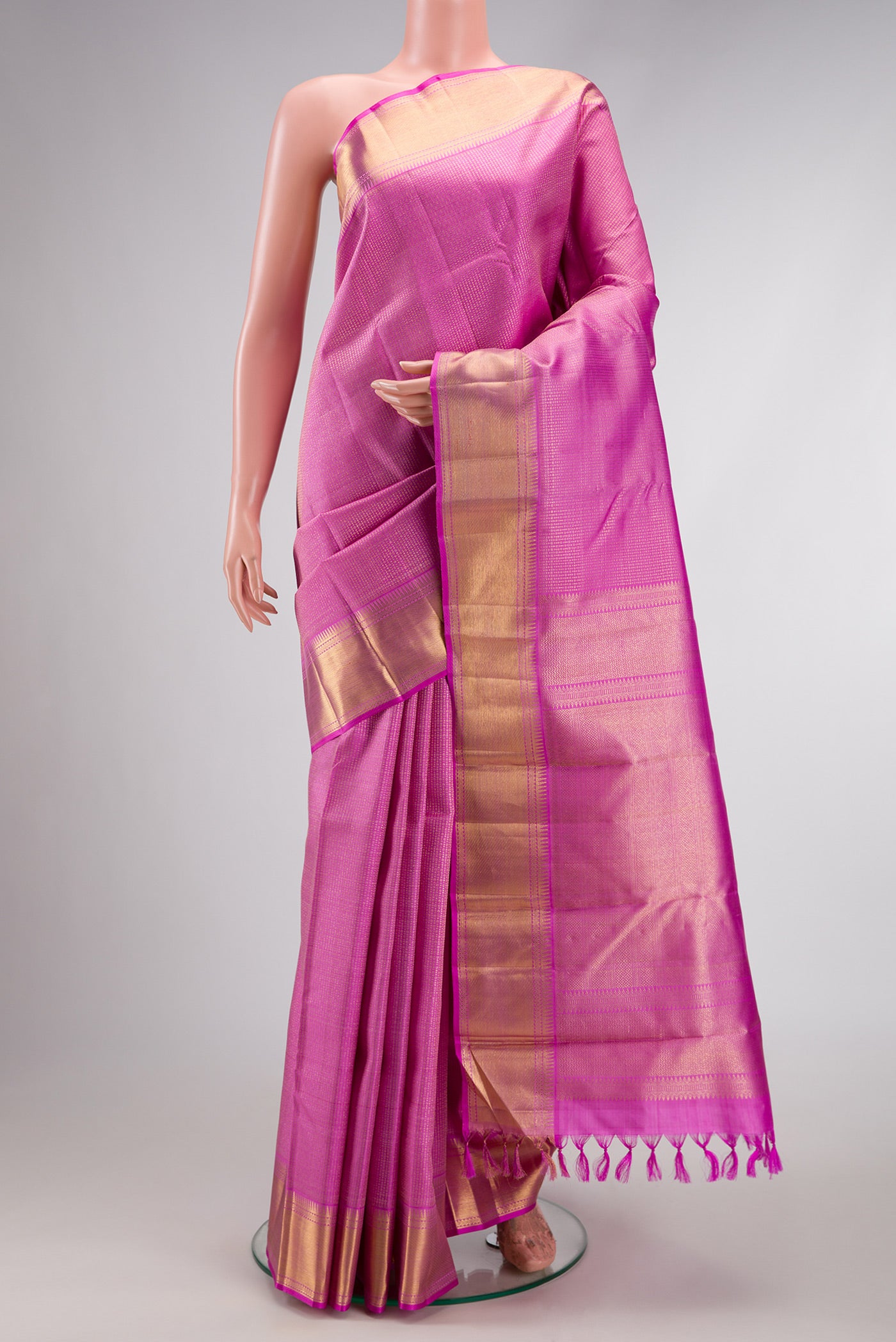 Lavender Dual Tone Kanchipuram Silk Saree with Zari Brocade on the body and Zari Border.  displayed on a mannequin