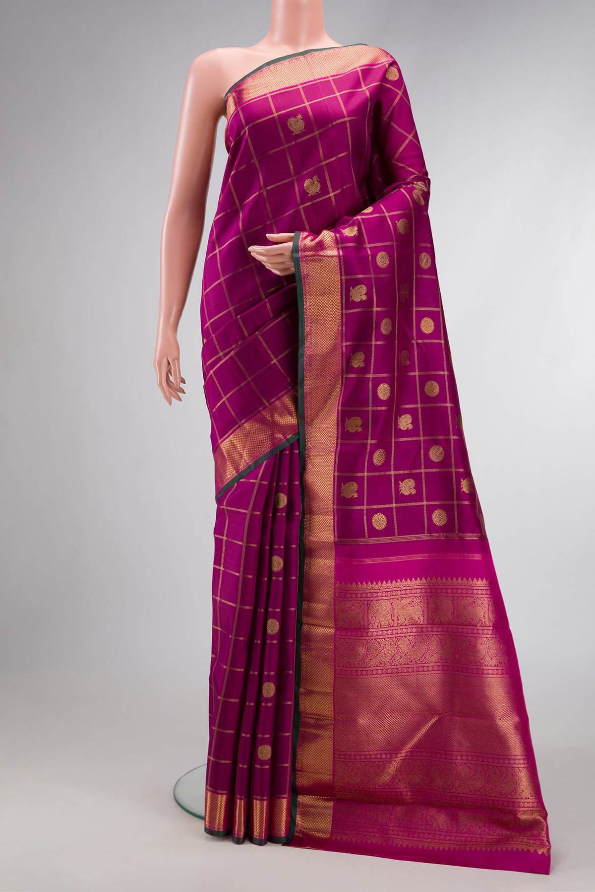 Pure Silk Pure Zari Magenta Dual Tone Kanjivaram Saree with Checked design on the body and Zari Border.  displayed on a mannequin