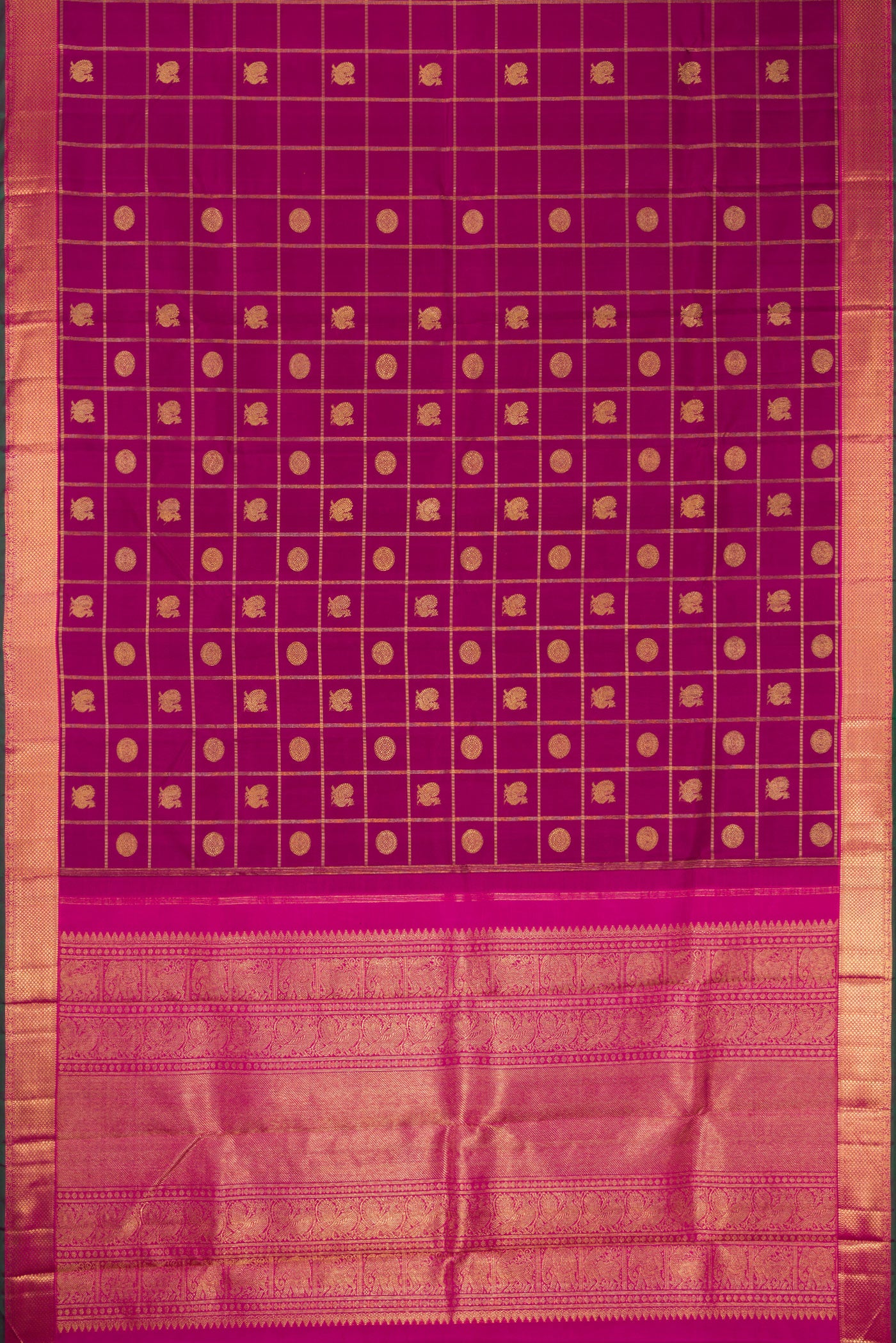 Flat view of Pure Silk Pure Zari Magenta Dual Tone Kanjivaram Saree with Checked design on the body and Zari Border. 