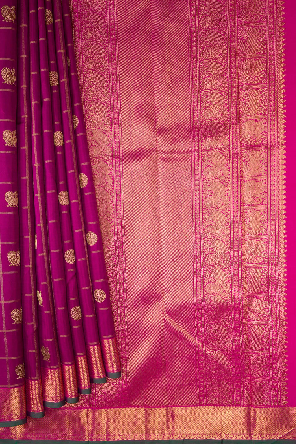 Pleats and pallu of Pure Silk Pure Zari Magenta Dual Tone Kanjivaram Saree with Checked design on the body and Zari Border. 