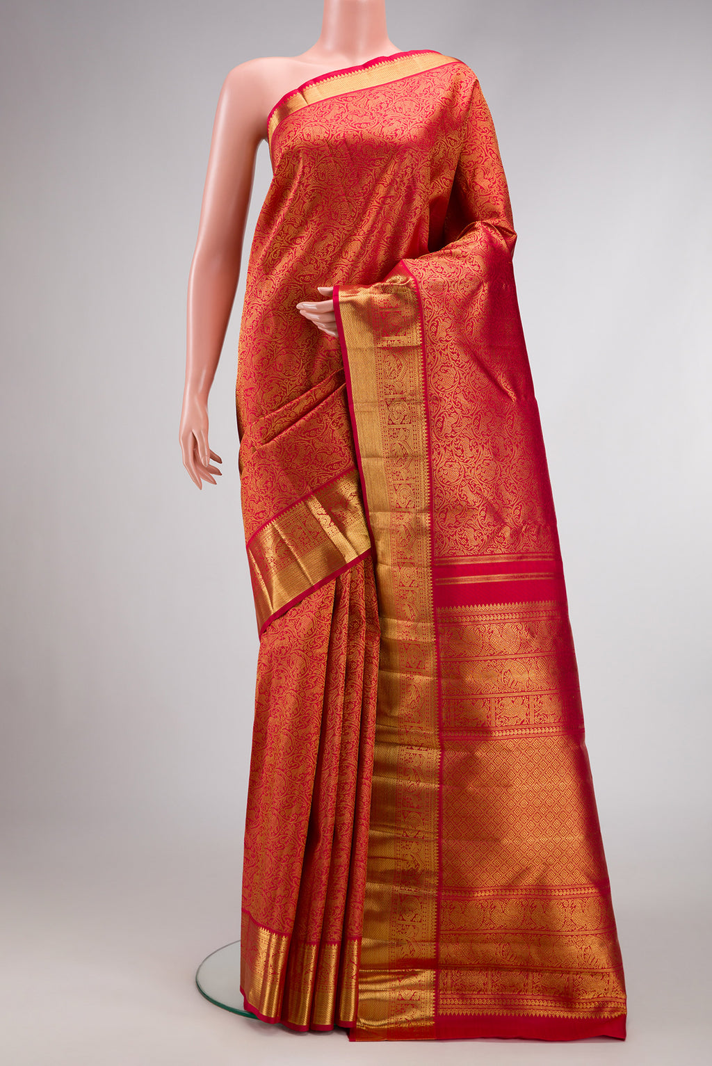 Pure Silk Pure Zari Dark Pink Dual Tone Kanjivaram Saree with Zari Brocade on the body and Zari Border.  displayed on a mannequin