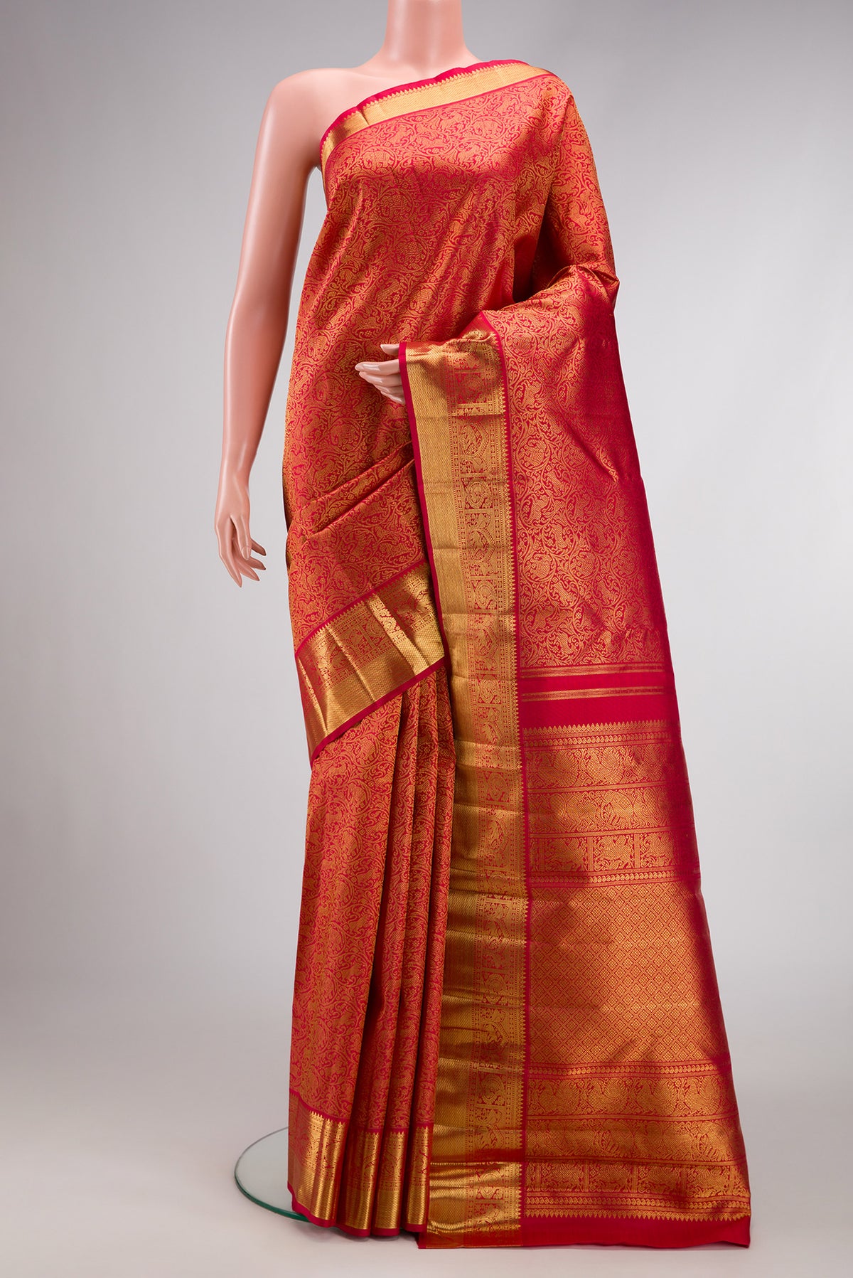 Pure Silk Pure Zari Dark Pink Dual Tone Kanjivaram Saree with Zari Brocade on the body and Zari Border.  displayed on a mannequin