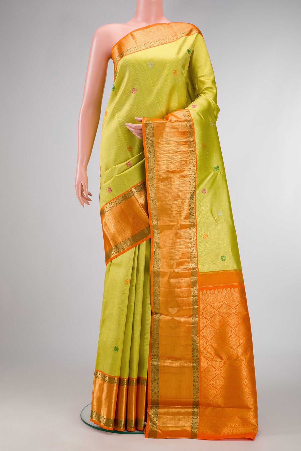 Lemon Yellow Dual Tone Kanchipuram Silk Saree with Zari Brocade on the body and Zari Border.  displayed on a mannequin