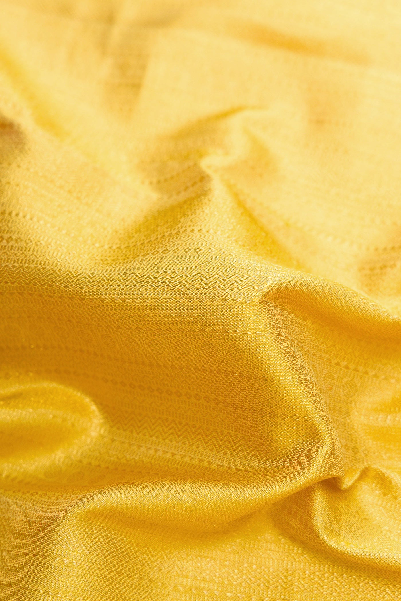 Close up of Sandal Dual Tone Kanchipuram Silk Saree with Zari Brocade on the body and Zari Border.  displaying folds