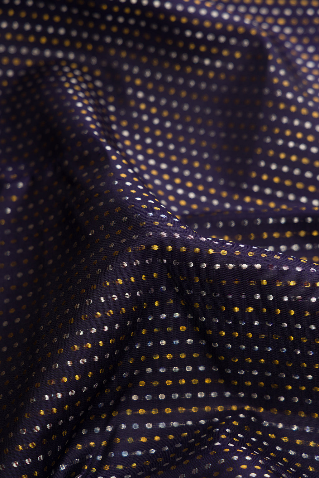 Close up of Navy Blue Dual Tone Kanjivaram Silk Saree with Zari Butta on the body and Zari Border.  displaying folds