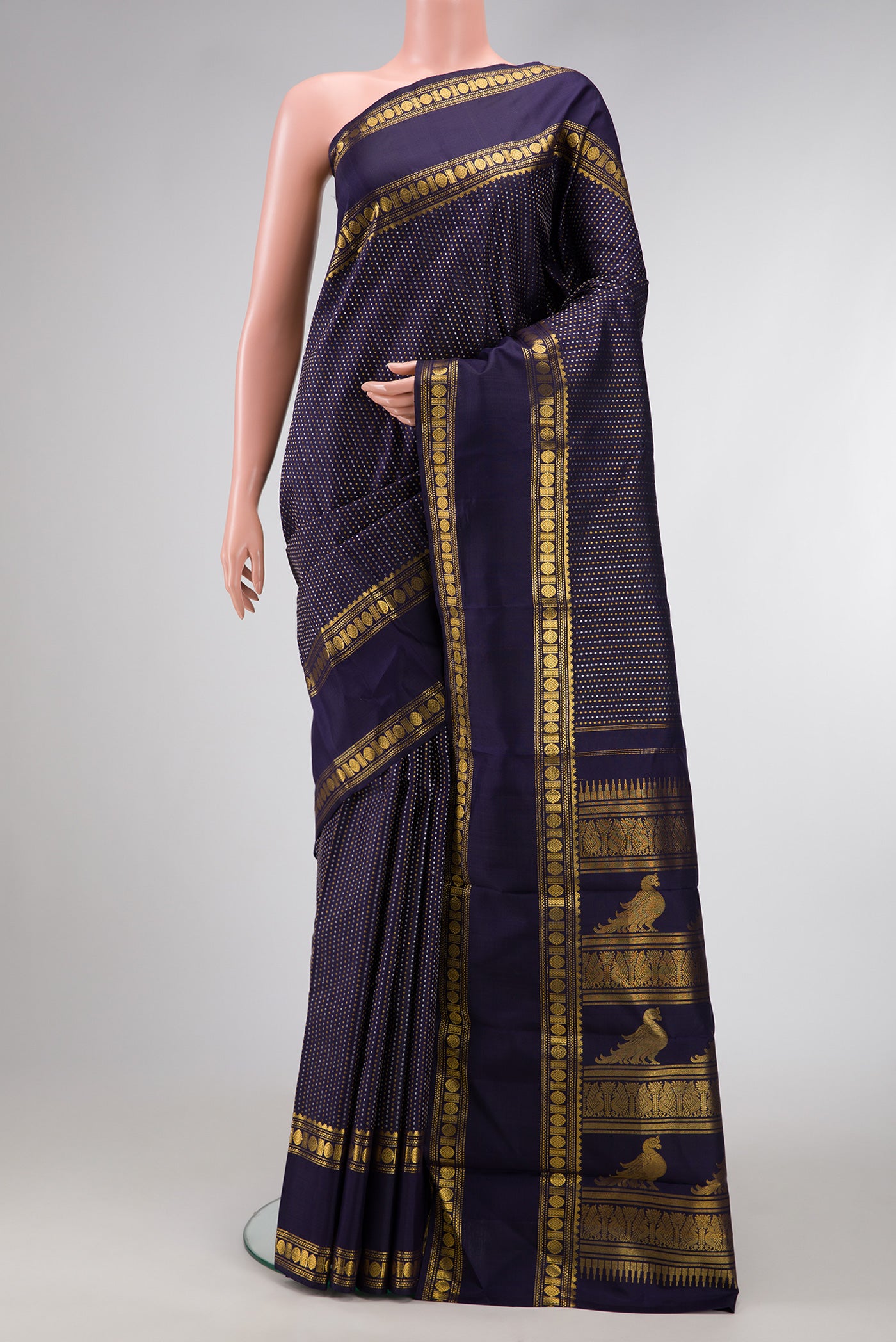 Navy Blue Dual Tone Kanjivaram Silk Saree with Zari Butta on the body and Zari Border.  displayed on a mannequin