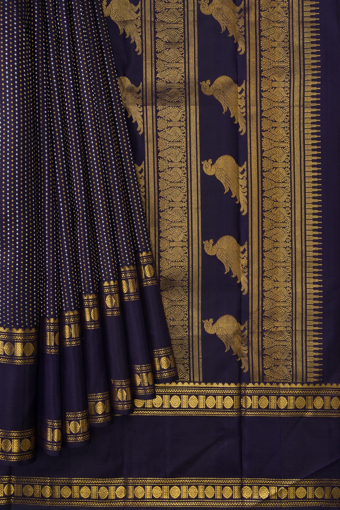 Pleats and pallu of Navy Blue Dual Tone Kanjivaram Silk Saree with Zari Butta on the body and Zari Border. 