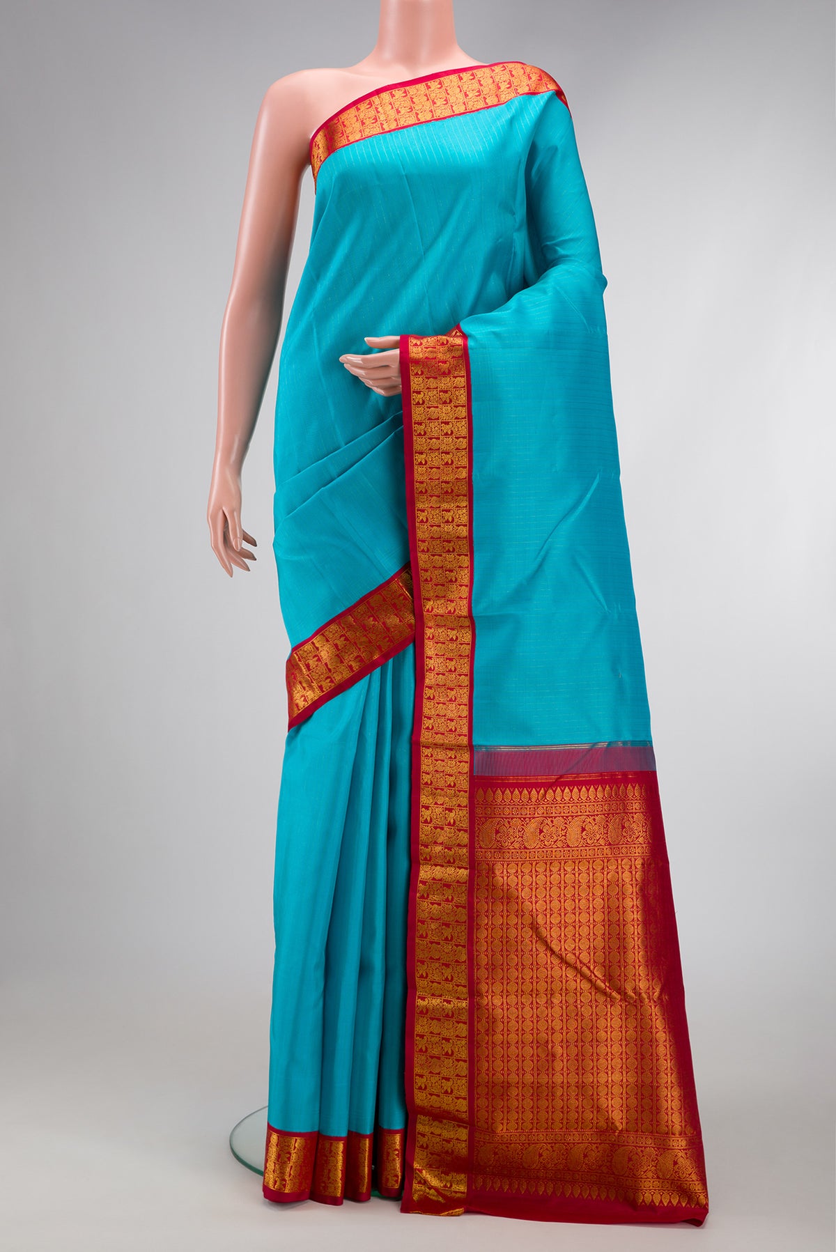 Sky Blue Dual Tone Kanjivaram Silk Saree with Stripes on the body and Zari Border.  displayed on a mannequin