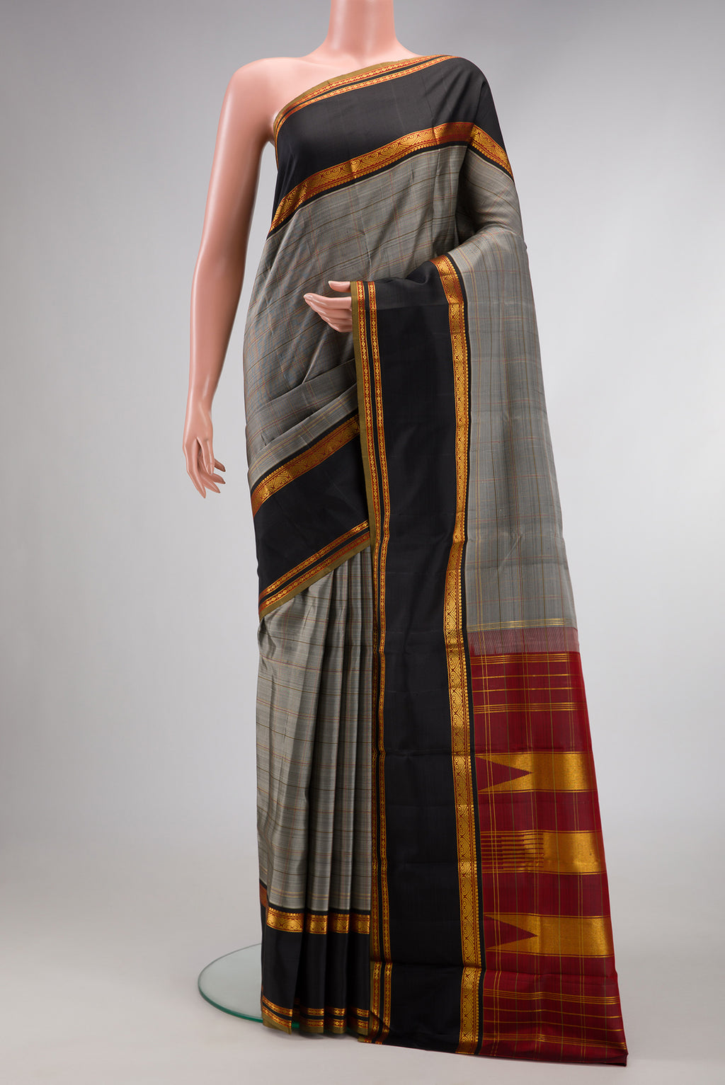Pure Silk Pure Zari Grey Dual Tone Kanchipuram Saree with Checked design on the body and Zari Border.  displayed on a mannequin