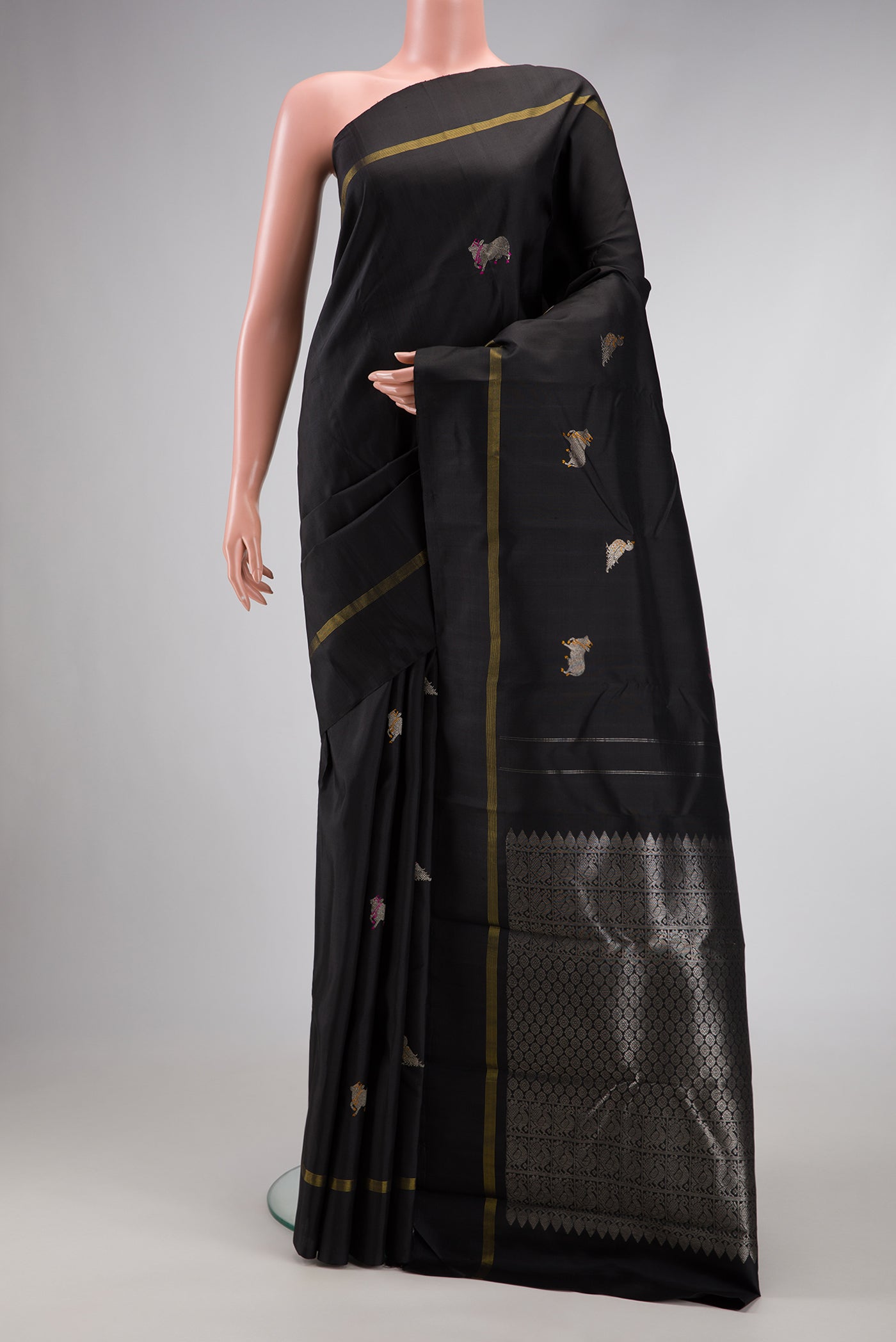 Black Dual Tone Kanjivaram Silk Saree with Zari And Thread Butta on the body and Zari Border.  displayed on a mannequin