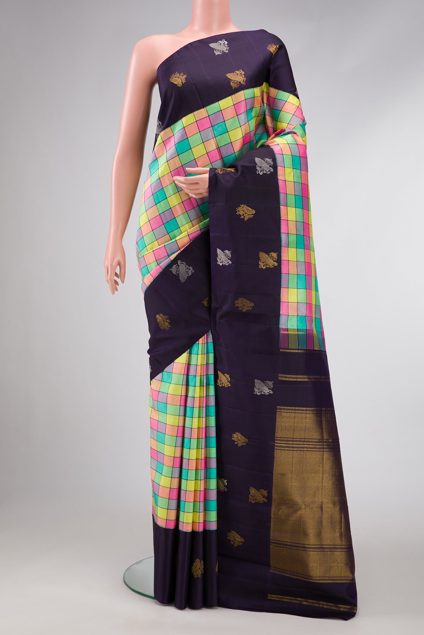 Pure Silk Pure Zari Green, Pink, Peach and Yellow Color Kanjivaram Saree with Checked design on the body and Fancy Border.  displayed on a mannequin