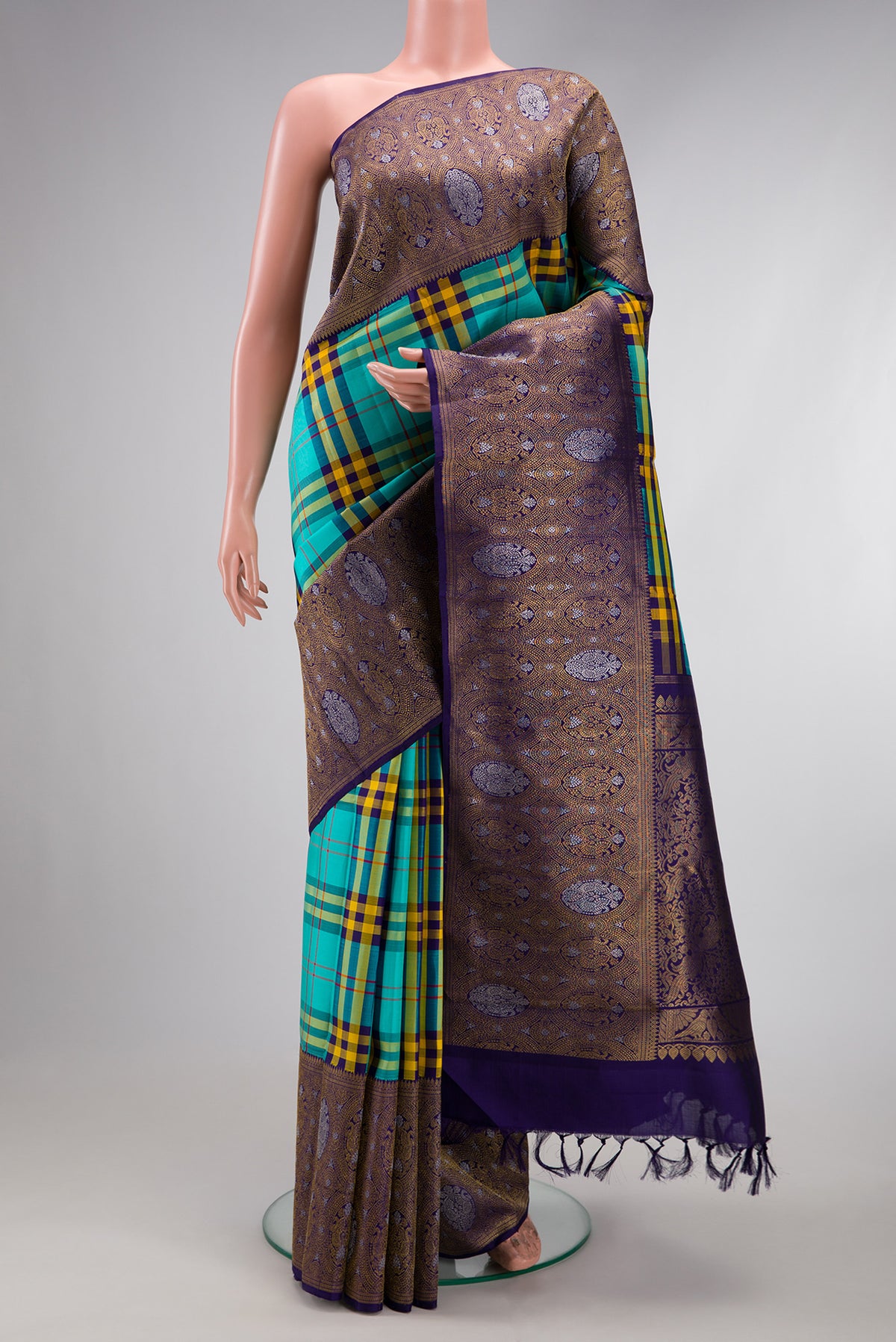 Pure Silk Pure Zari Multi Color Kanjivaram Saree with Checked design on the body and Fancy Border.  displayed on a mannequin