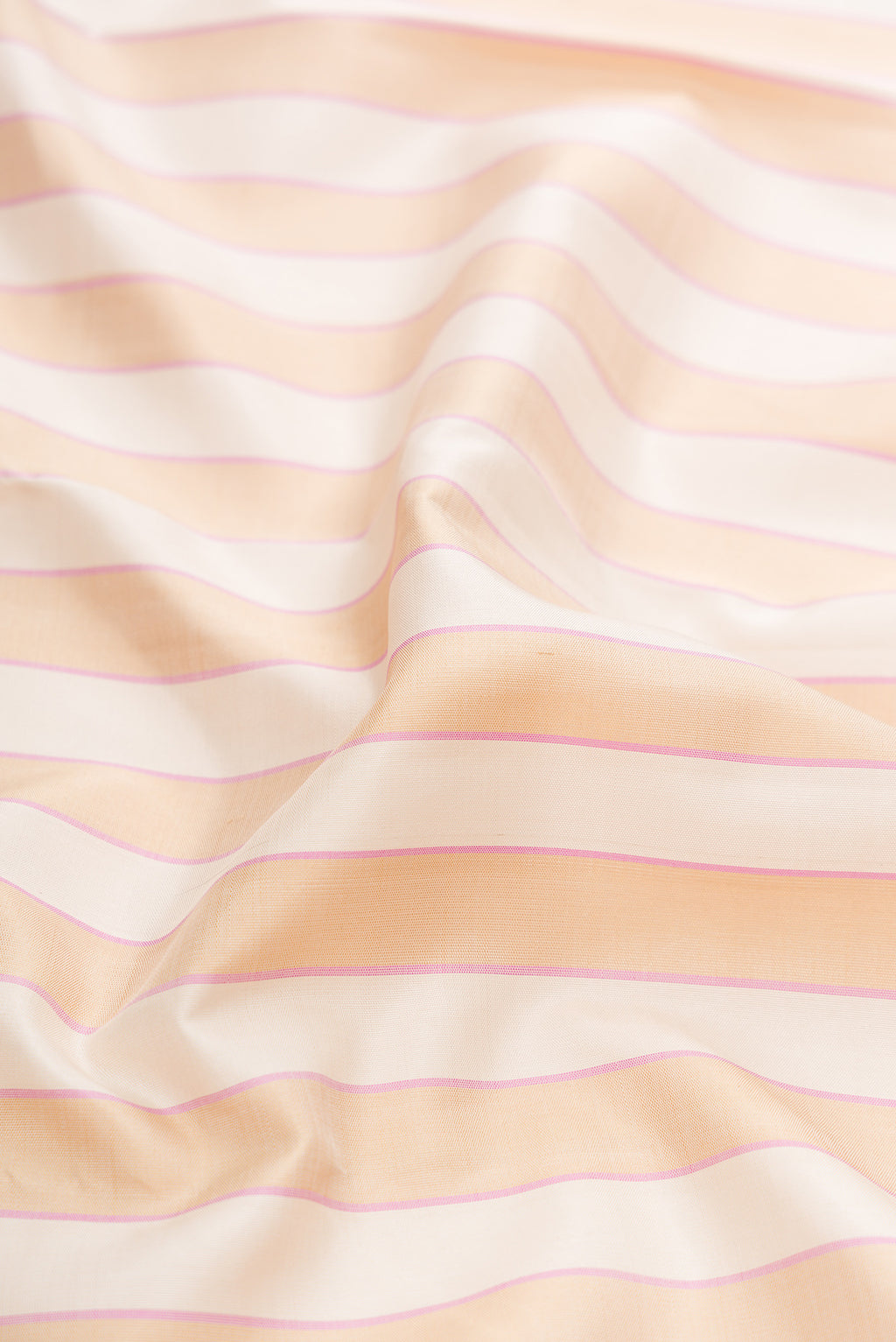 Close up of Multi Color Kanjivaram Silk Saree with Stripes on the body and Temple Border.  displaying folds