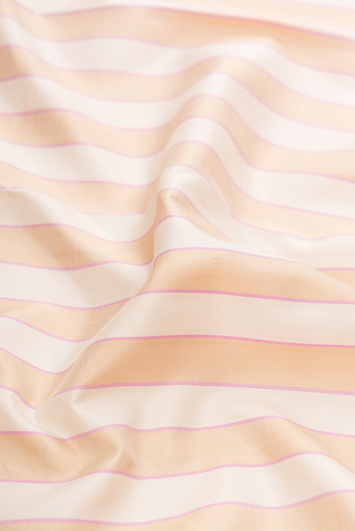 Close up of Multi Color Kanjivaram Silk Saree with Stripes on the body and Temple Border.  displaying folds