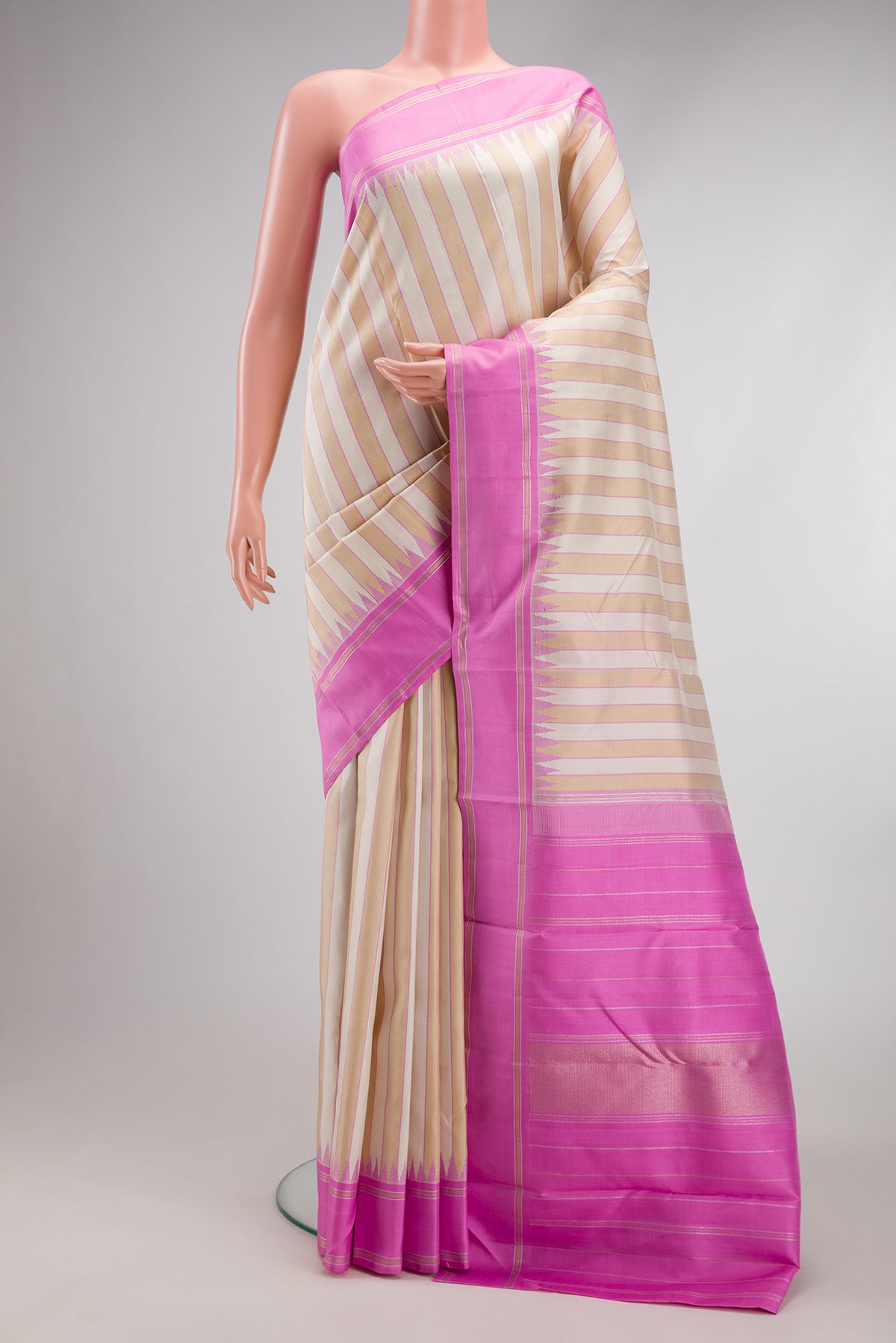 Multi Color Kanjivaram Silk Saree with Stripes on the body and Temple Border.  displayed on a mannequin