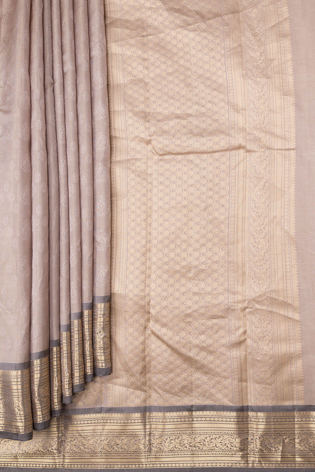 Pleats and pallu of Beige Dual Tone Kanchipuram Silk Saree with Jacquard design on the body and Zari Border. 