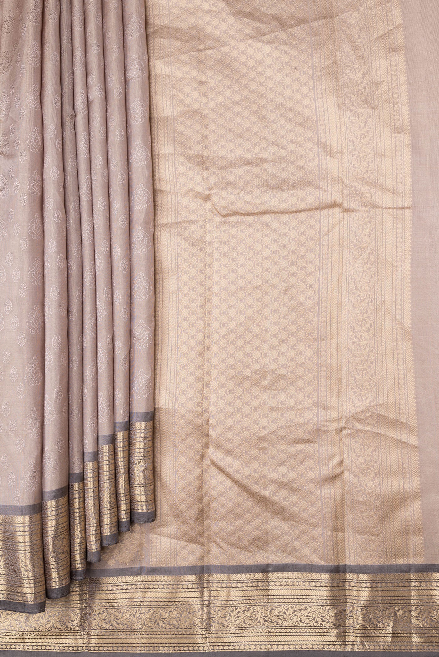 Pleats and pallu of Beige Dual Tone Kanchipuram Silk Saree with Jacquard design on the body and Zari Border. 