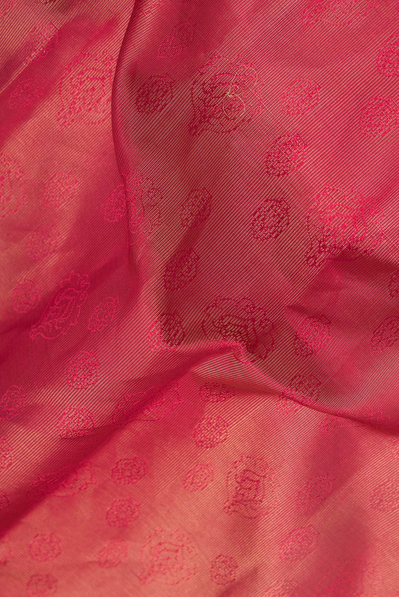 Close up of Maroon Dual Tone Kanchipuram Silk Saree with Jacquard design on the body and Zari Border.  displaying folds
