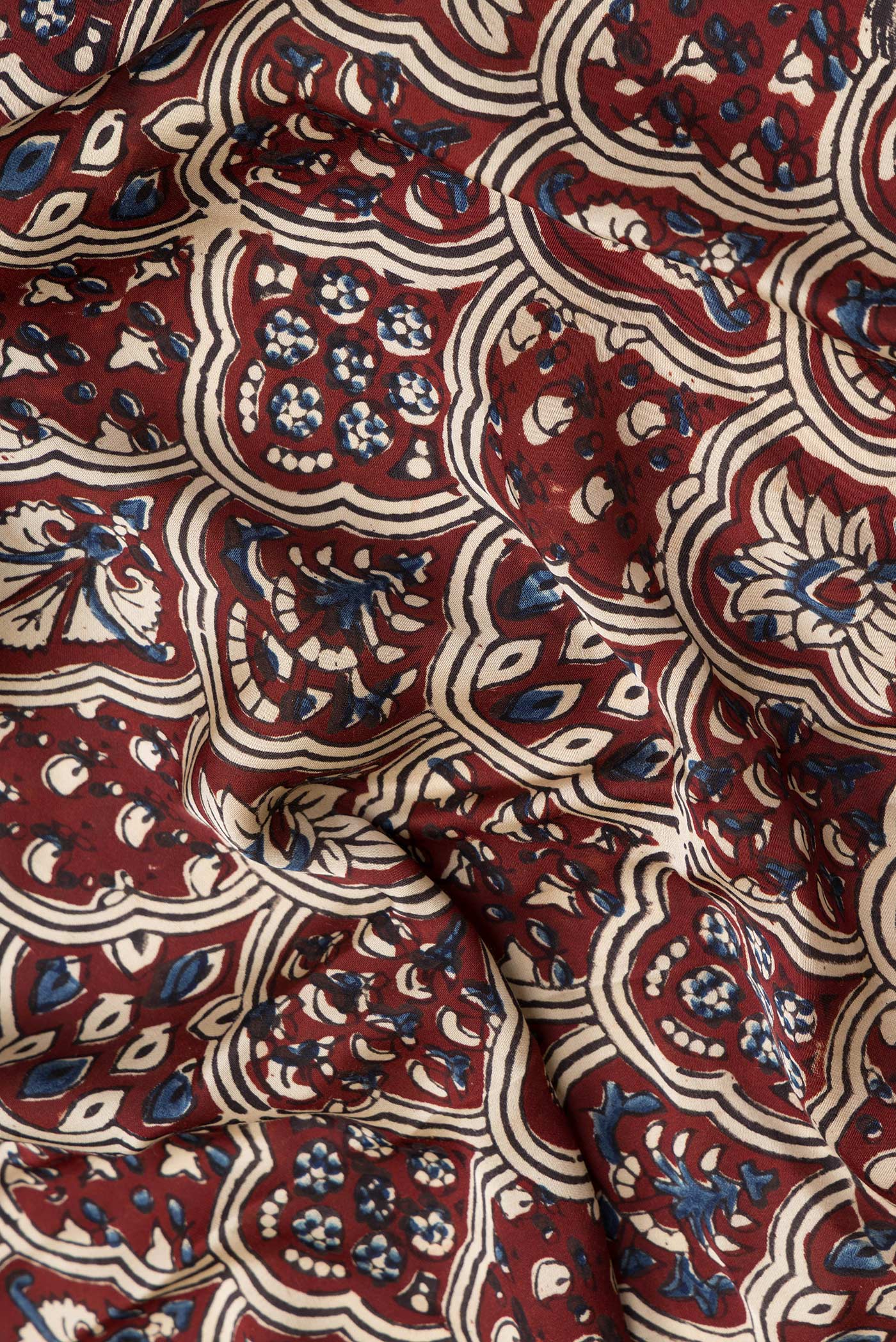 Close up of Beige Dual Tone Blended Satin Crepe Saree with Printed design on the body and Printed Border.  displaying folds