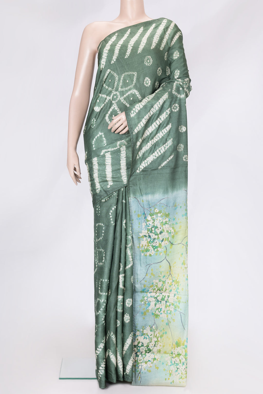 Mehandi Green Dual Tone Tussar Silk Saree with Embroidery on the body and Without Border.  displayed on a mannequin