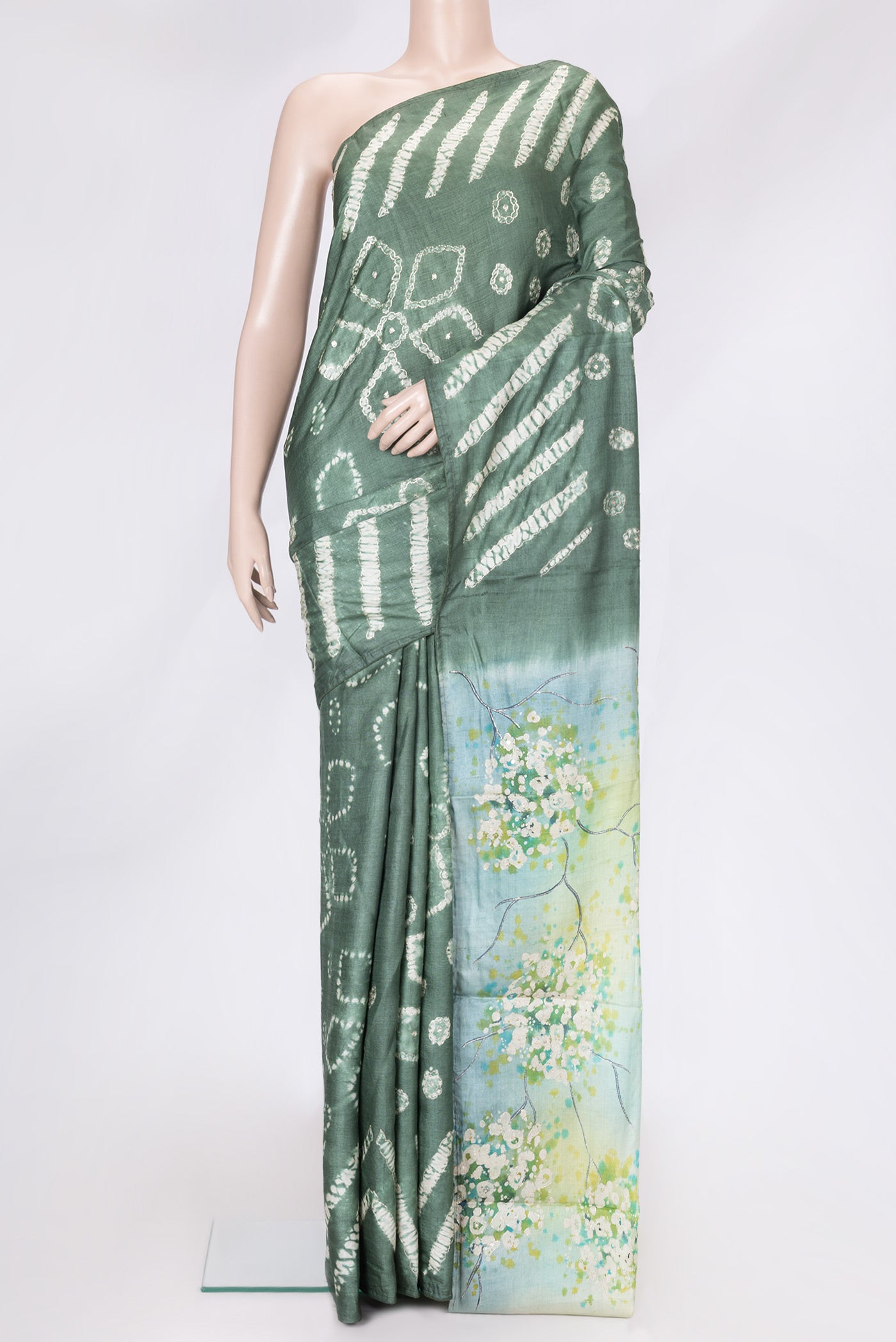 Mehandi Green Dual Tone Tussar Silk Saree with Embroidery on the body and Without Border.  displayed on a mannequin