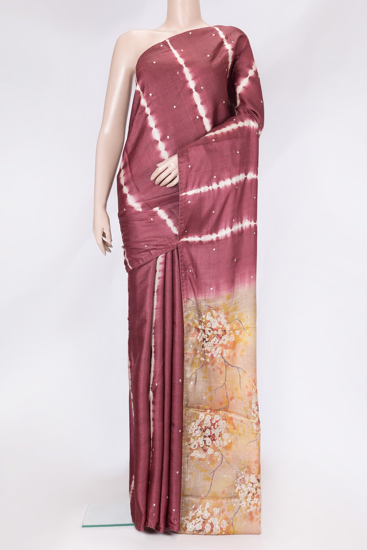 Maroon Dual Tone Tussar Silk Saree with Embroidery on the body and Without Border.  displayed on a mannequin