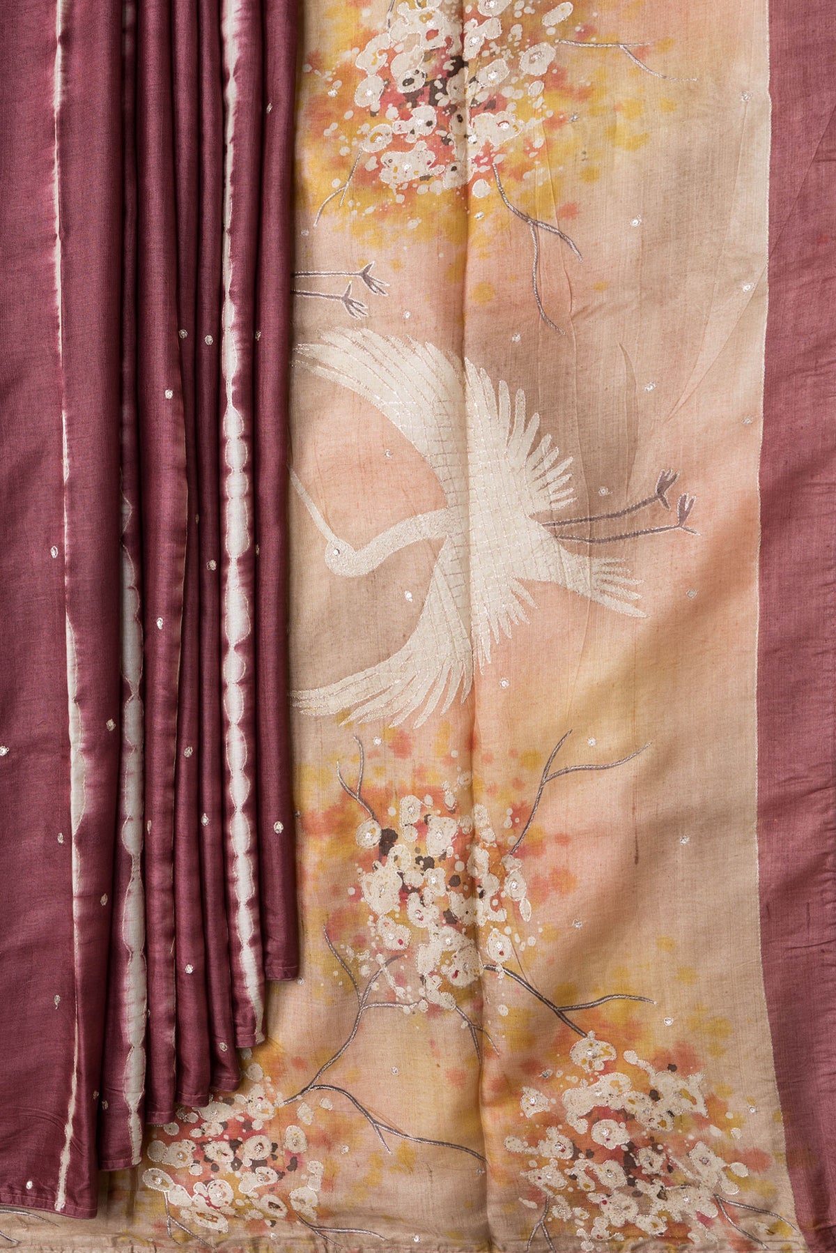 Pleats and pallu of Maroon Dual Tone Tussar Silk Saree with Embroidery on the body and Without Border. 