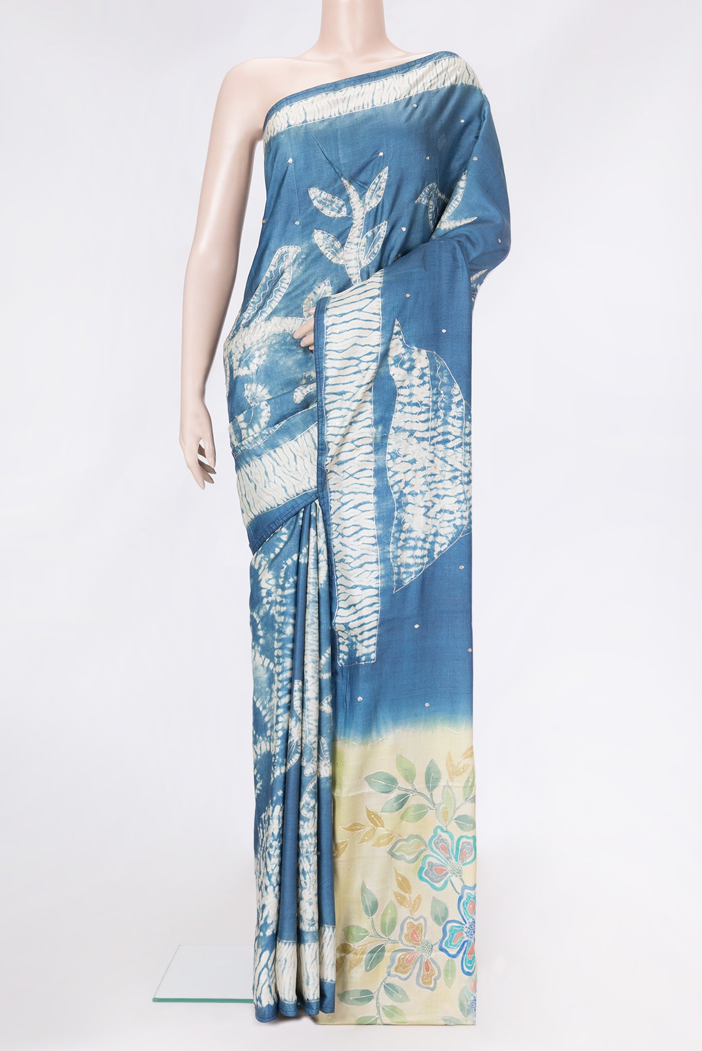 Grey Dual Tone Tussar Silk Saree with Embroidery on the body and Fancy Border.  displayed on a mannequin