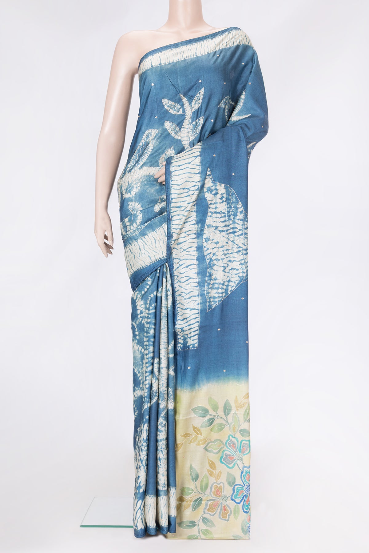 Grey Dual Tone Tussar Silk Saree with Embroidery on the body and Fancy Border.  displayed on a mannequin