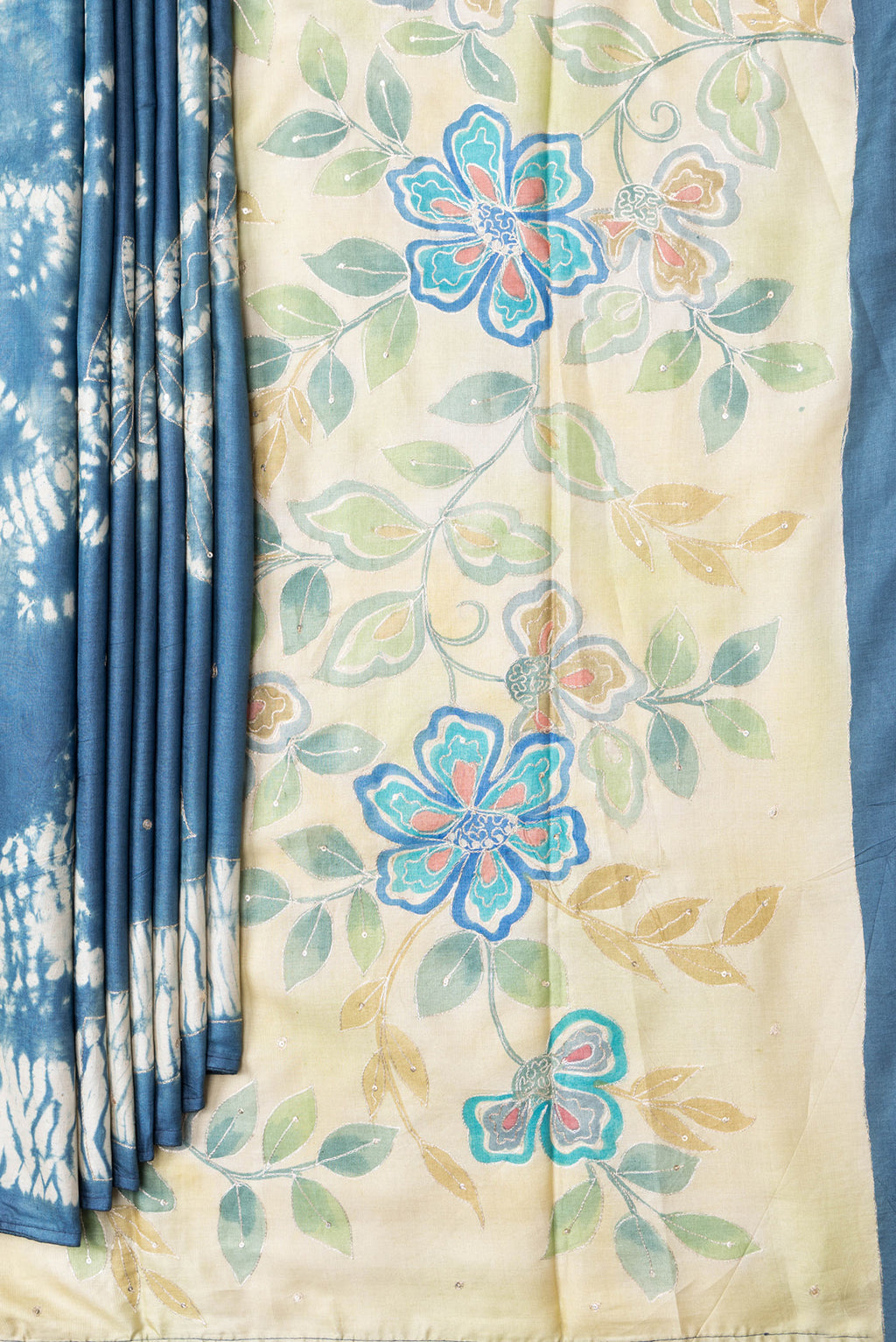 Pleats and pallu of Grey Dual Tone Tussar Silk Saree with Embroidery on the body and Fancy Border. 