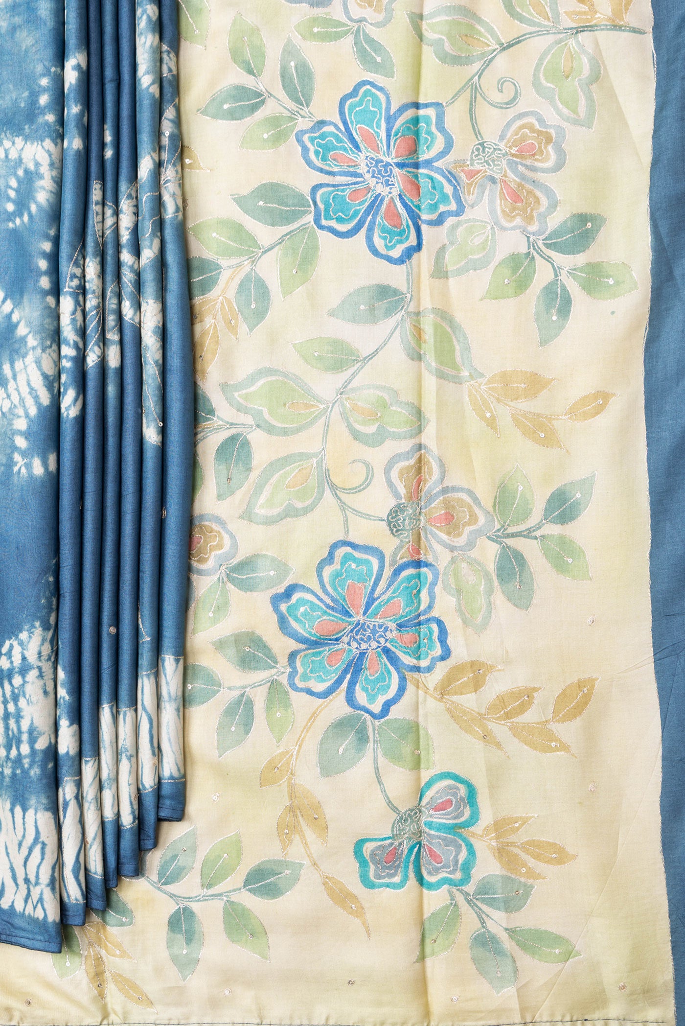 Pleats and pallu of Grey Dual Tone Tussar Silk Saree with Embroidery on the body and Fancy Border. 