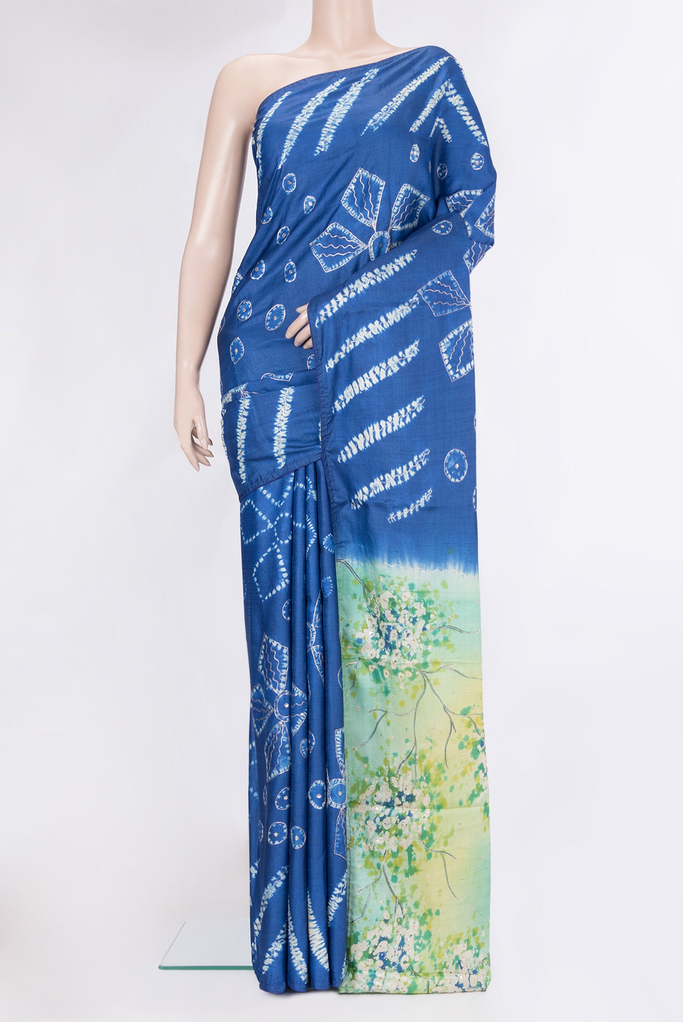Royal Blue Tussar Silk Saree with Embroidery on the body and Fancy Border.  displayed on a mannequin